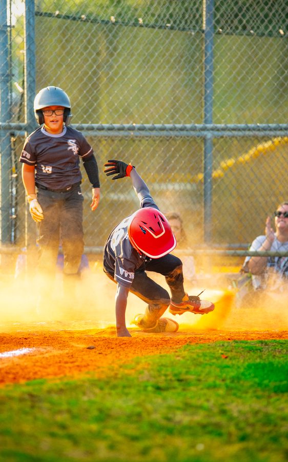 Youth Baseball Championship — sliding into base